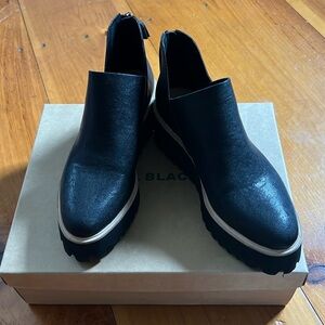 All Black platform boot.